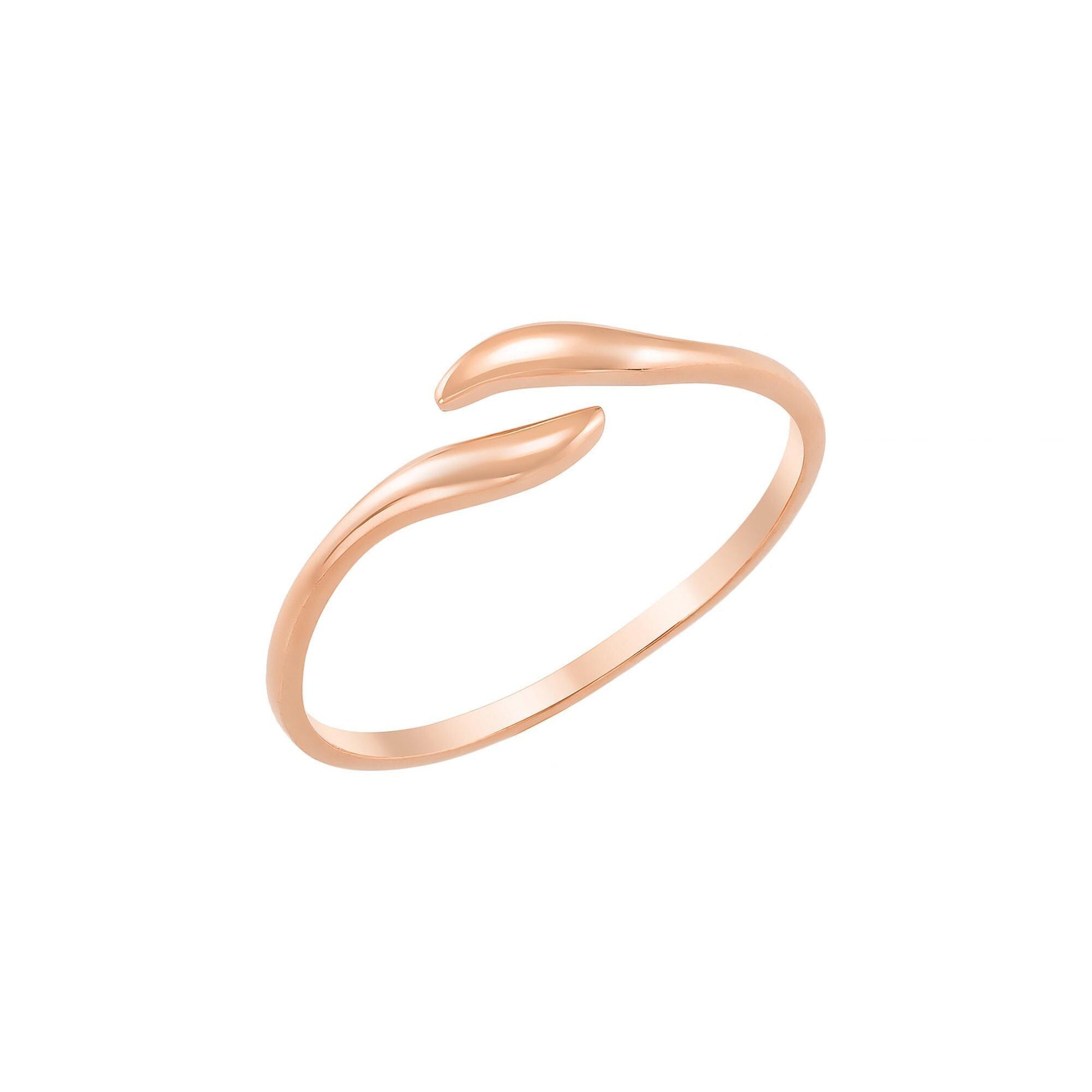 A gold ring with a curved band and a small, intricate design.