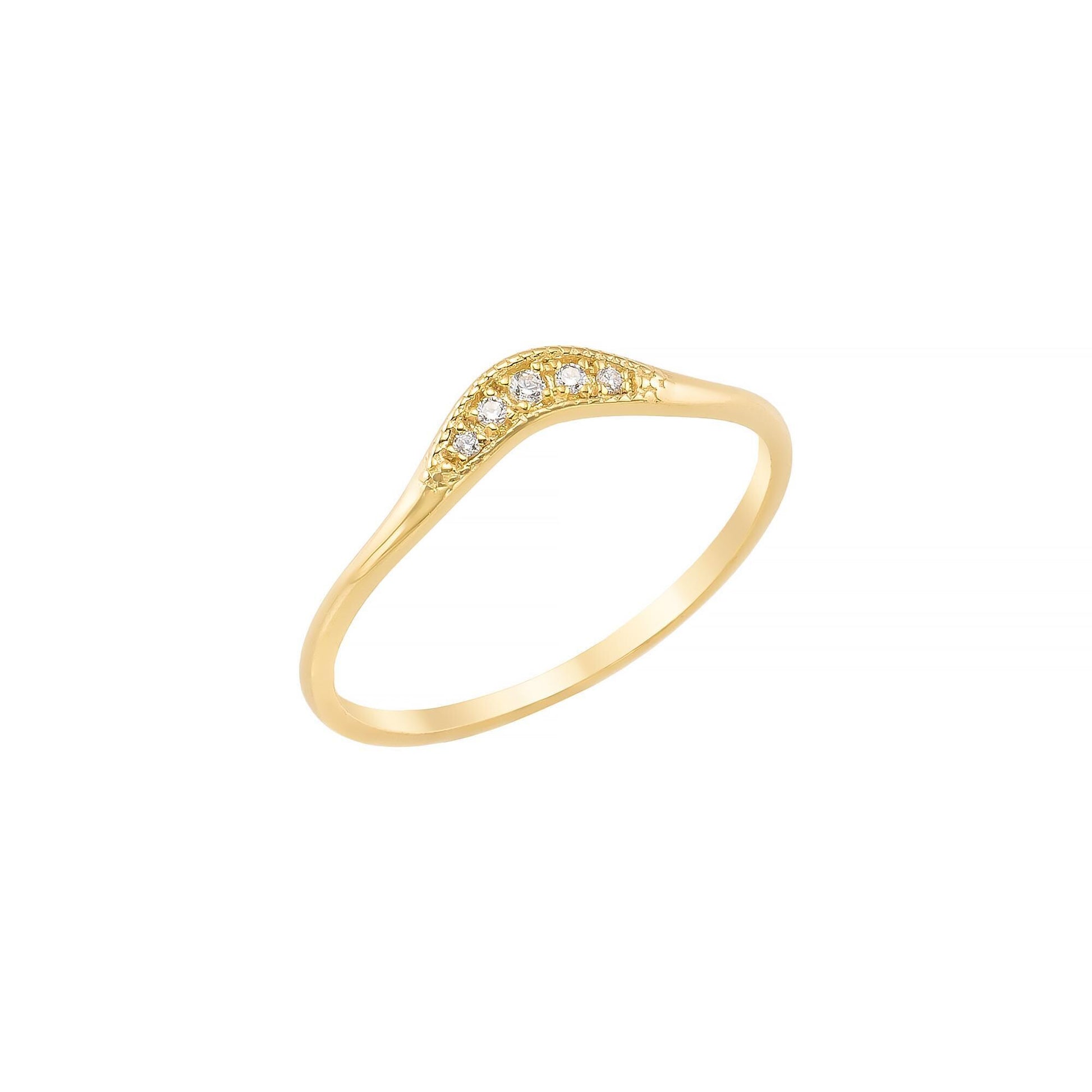 A gold ring with a curved band and small diamonds set in it.