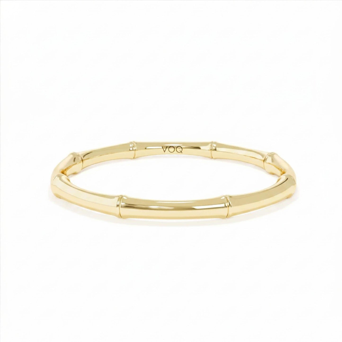 A gold-colored bracelet with a curved design.