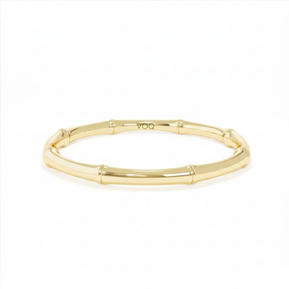 A gold-colored bracelet with a curved design.