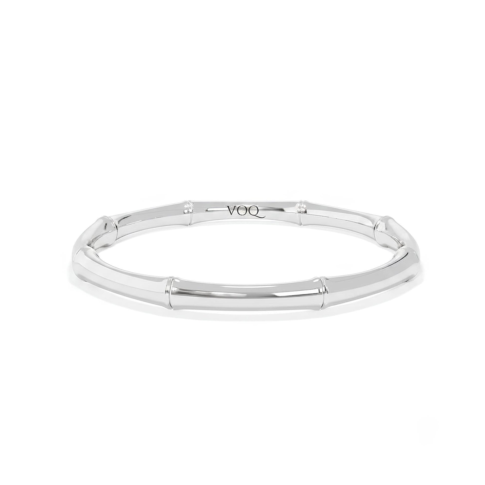 A silver bracelet with a curved design.