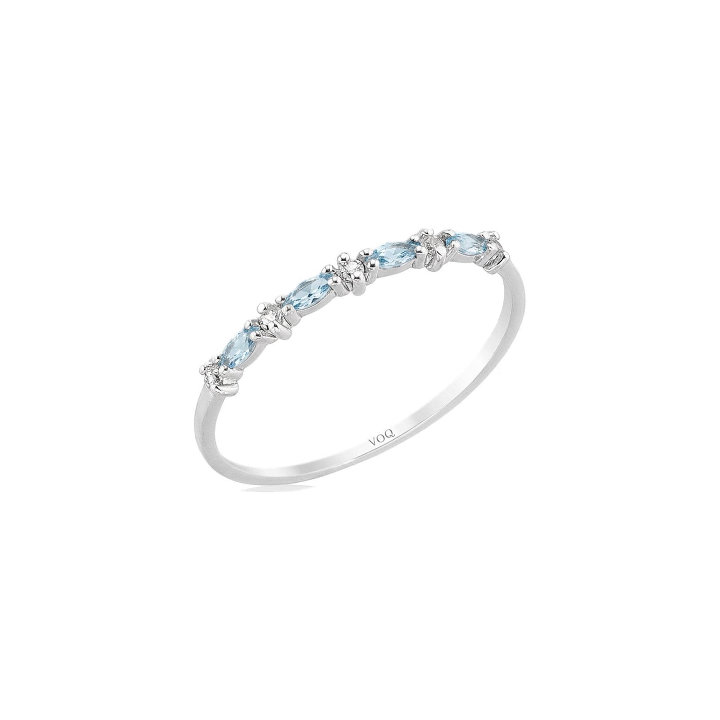 A silver ring with a row of aquamarine marquise and round moissanite stones on the band.