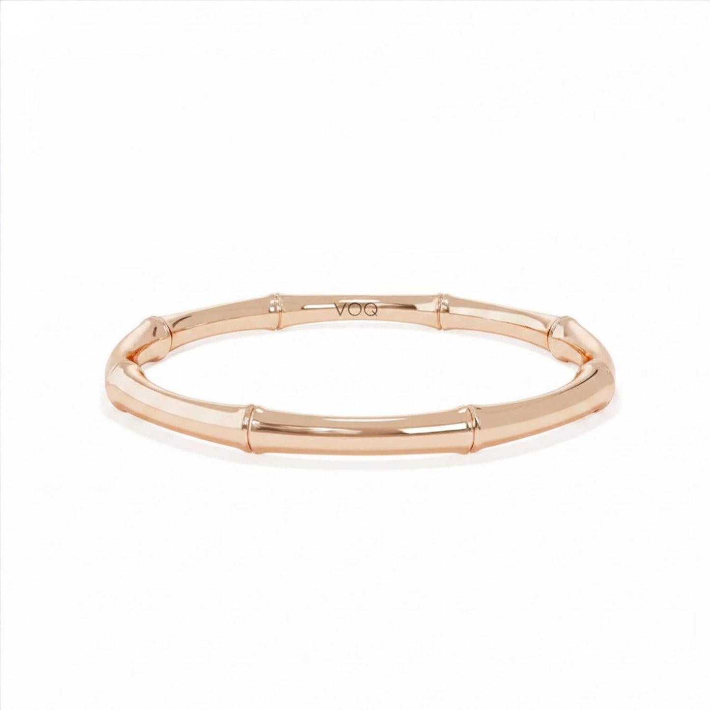 A gold-colored bracelet with a curved design.