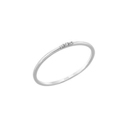 A simple silver ring with three small diamonds set in the center.