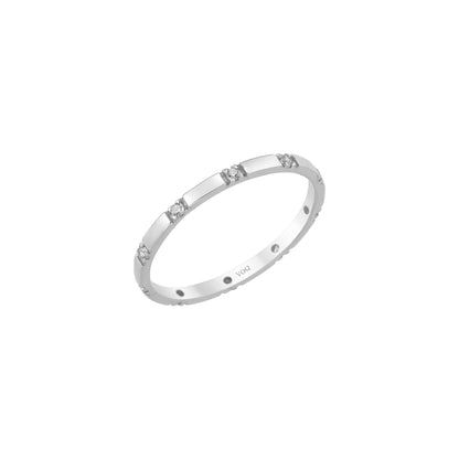 A silver ring with small diamonds set in it.