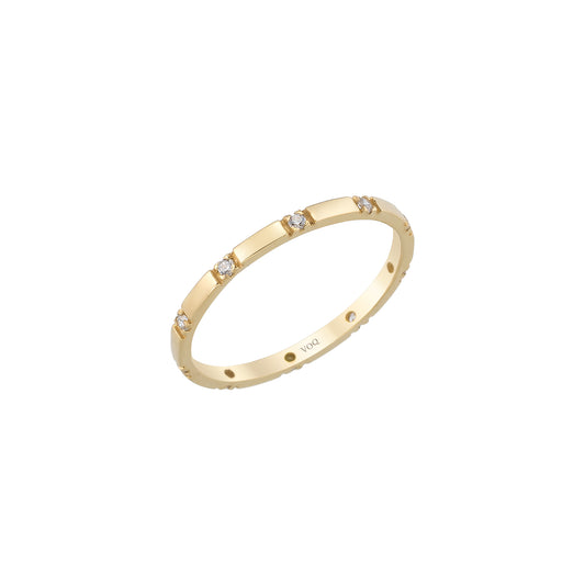 A gold ring with small diamonds set in it.
