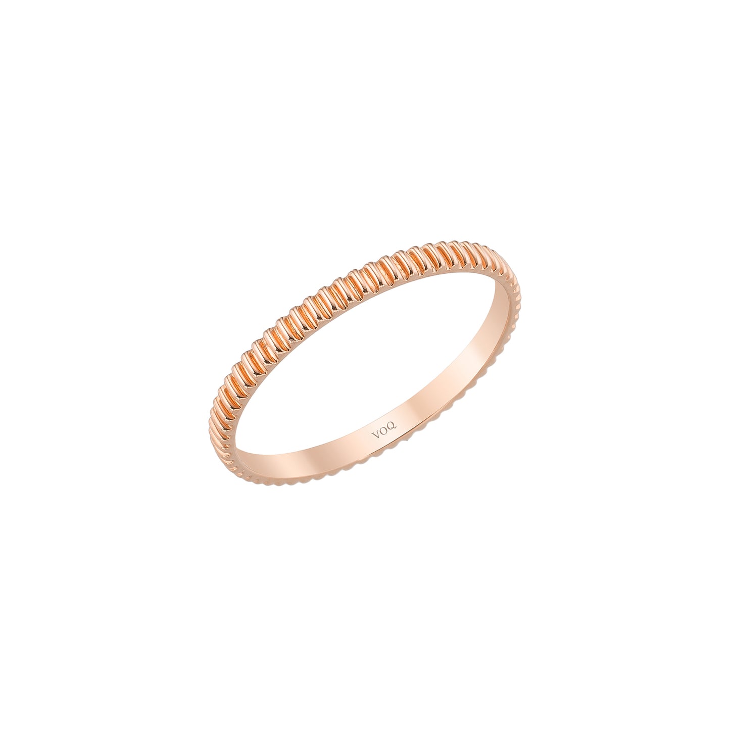 A single, round gold ring with a textured band.