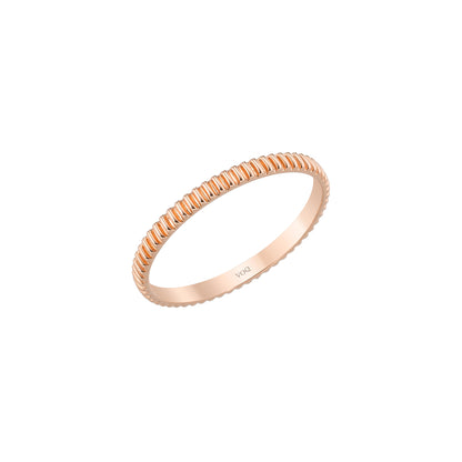 A single, round gold ring with a textured band.