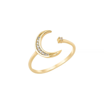 A gold ring with a crescent moon design and small diamonds set in it.