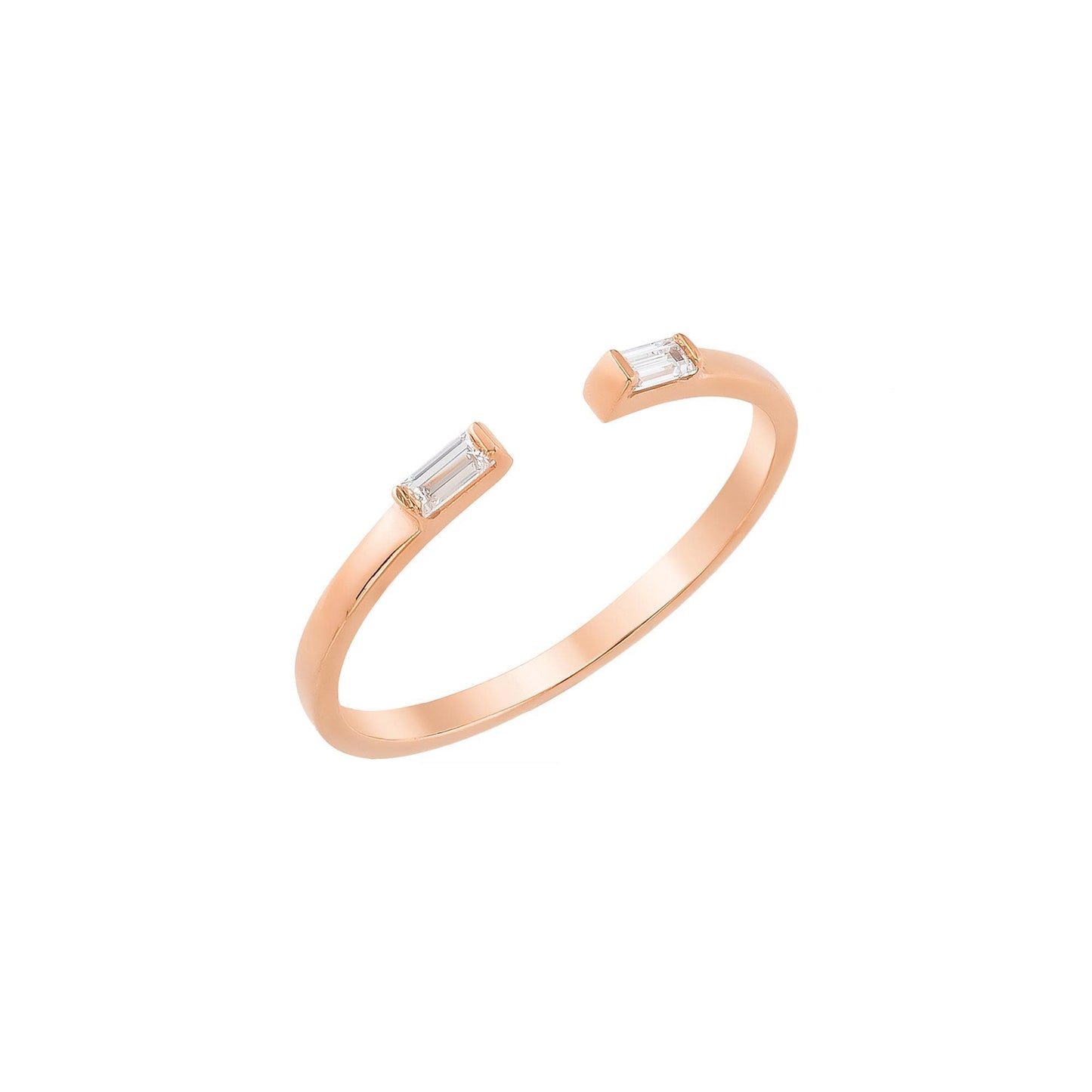 A gold ring with a unique design, featuring two small rectangular stones on either side of the band.