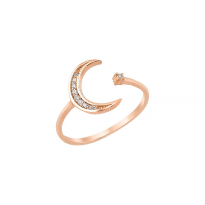 A gold ring with a crescent moon design and small diamonds set in it.