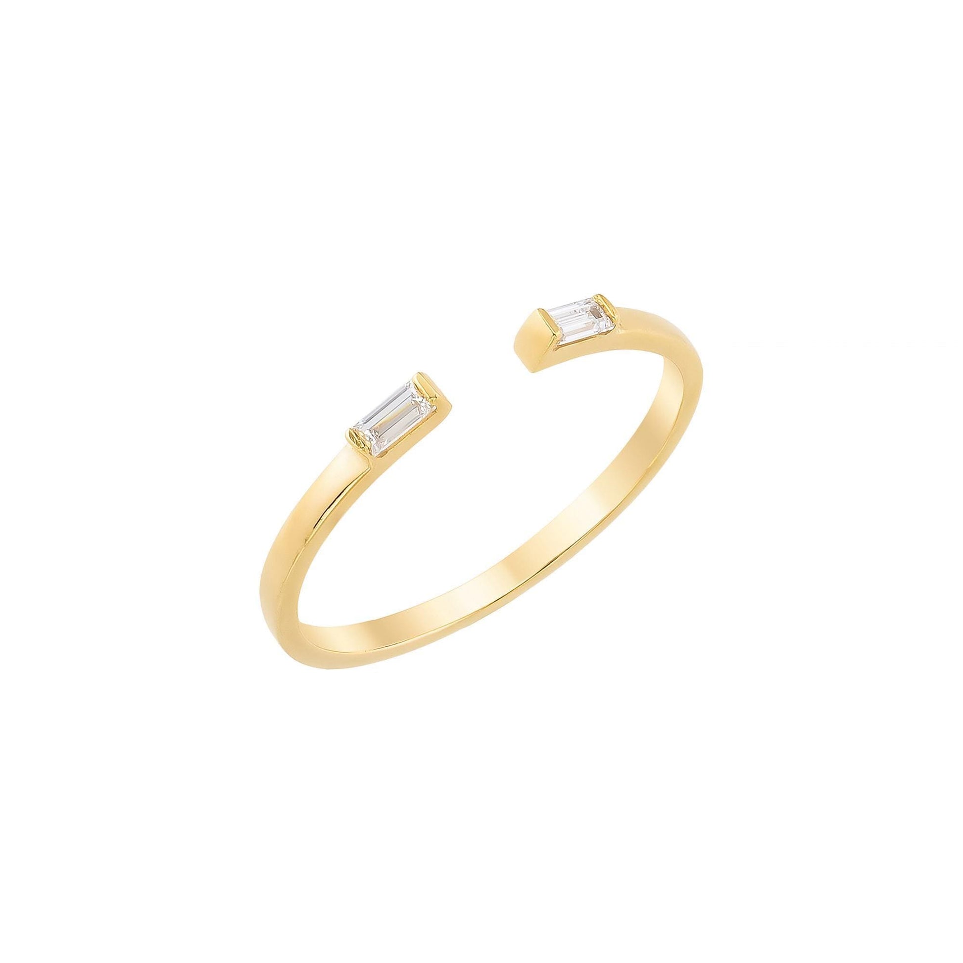 A gold ring with two diamond-encrusted pieces on either side of a central band.